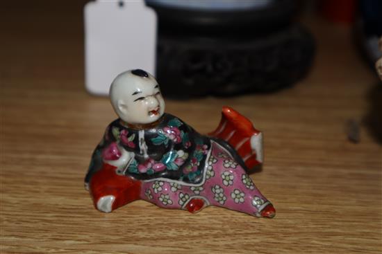 Two Chinese famille rose dishes, a figure of a boy, a porcelain brush pot and a bamboo brush pot tallest 28cm